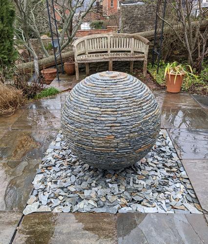 800mm Rustic Watersphere™ set upon a square bed of loose slate chippings, Tiverton.