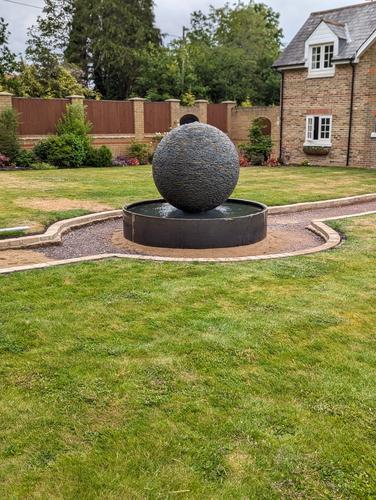 Jeremy Hastings 1.2m extra large rustic slate ball water feature, on a Corten steel pool