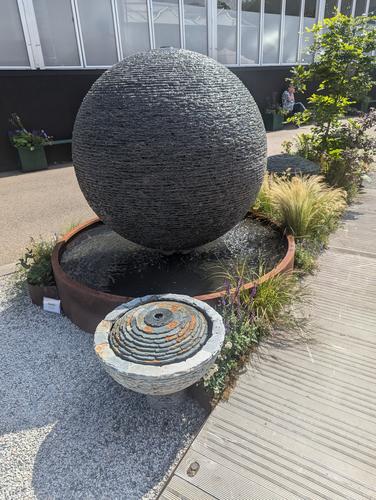 Jeremy Hastings 5 star award winning stand at RHS Chelsea 2025 showcasing the grand 1,5m diameter slate ball