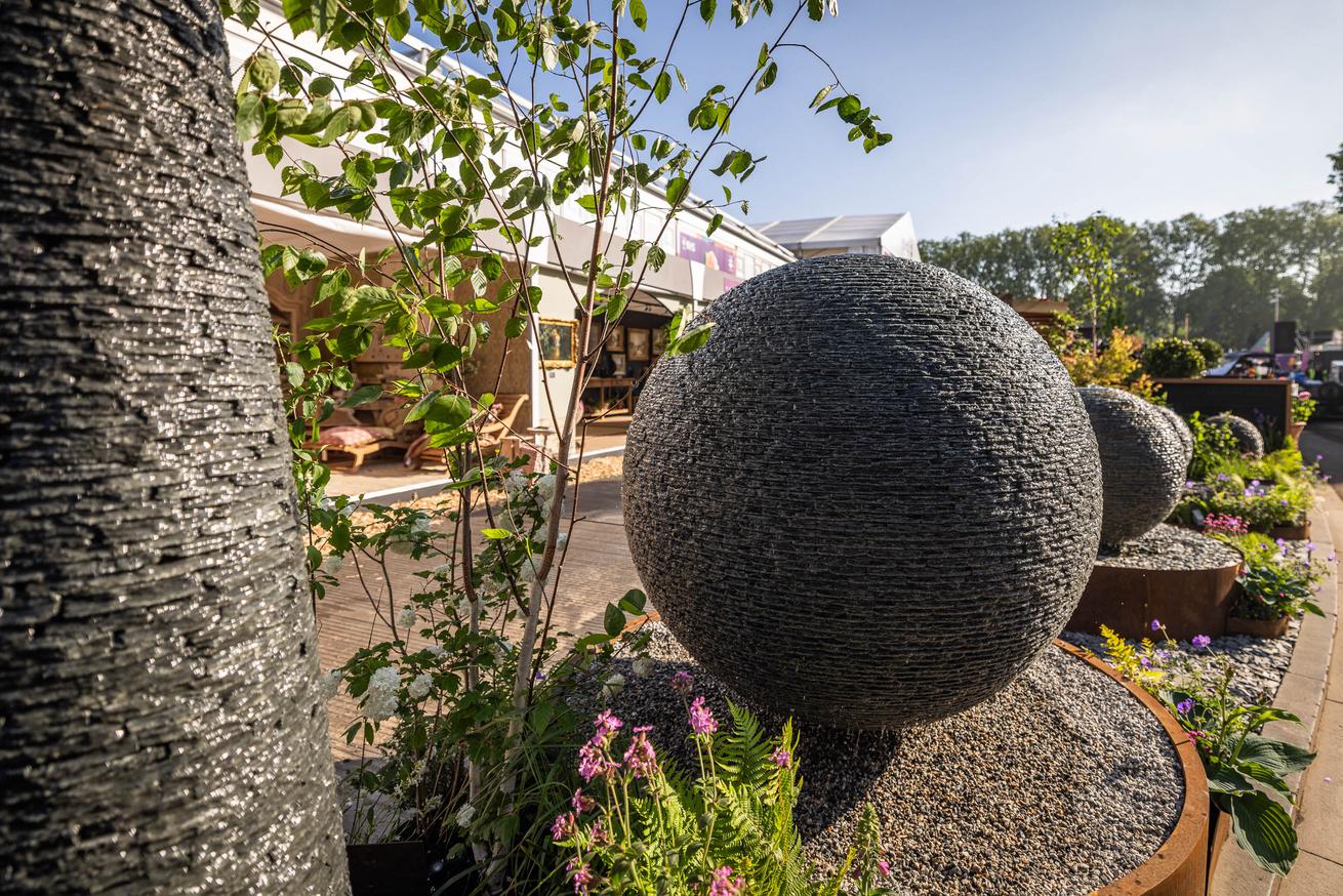 Jeremy Hastings Cornish slate 1.5m Grey Watersphere and 1m Rustic Wtersphere displayed at RHS Chelsea Flower Show 2024