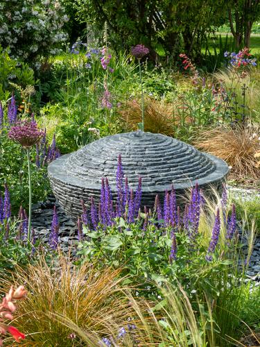 Jeremy Hastings bespoke water feature grey slate over flowing semi-sphere; a unique water feature design
