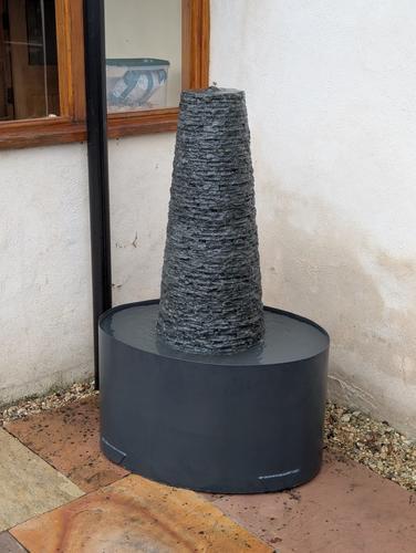 Jeremy Hastings Cornish chimney water feature in a courtyard garden