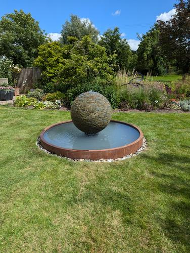 800mm Rustic Watersphere on a 2m wide Corten Steel Pool, Gloucestershire.